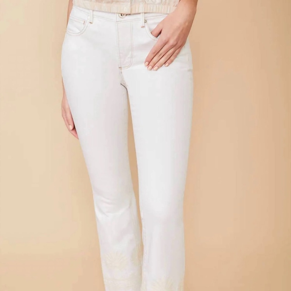Brand New stretch denim, w/ tonal embroidery on cuff and frayed edge. Size 25